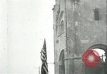 Image of U.S. troops raise flag on radio tower celebrating Armistice France, 1918, second 28 stock footage video 65675065322