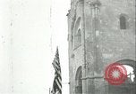 Image of U.S. troops raise flag on radio tower celebrating Armistice France, 1918, second 29 stock footage video 65675065322