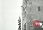 Image of U.S. troops raise flag on radio tower celebrating Armistice France, 1918, second 30 stock footage video 65675065322
