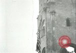 Image of U.S. troops raise flag on radio tower celebrating Armistice France, 1918, second 32 stock footage video 65675065322