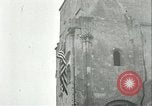 Image of U.S. troops raise flag on radio tower celebrating Armistice France, 1918, second 34 stock footage video 65675065322