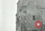 Image of U.S. troops raise flag on radio tower celebrating Armistice France, 1918, second 35 stock footage video 65675065322