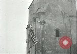 Image of U.S. troops raise flag on radio tower celebrating Armistice France, 1918, second 36 stock footage video 65675065322