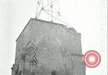 Image of U.S. troops raise flag on radio tower celebrating Armistice France, 1918, second 43 stock footage video 65675065322