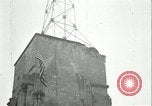 Image of U.S. troops raise flag on radio tower celebrating Armistice France, 1918, second 44 stock footage video 65675065322