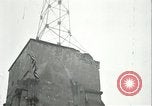 Image of U.S. troops raise flag on radio tower celebrating Armistice France, 1918, second 45 stock footage video 65675065322