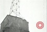 Image of U.S. troops raise flag on radio tower celebrating Armistice France, 1918, second 46 stock footage video 65675065322