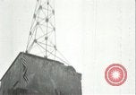 Image of U.S. troops raise flag on radio tower celebrating Armistice France, 1918, second 47 stock footage video 65675065322