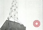 Image of U.S. troops raise flag on radio tower celebrating Armistice France, 1918, second 49 stock footage video 65675065322