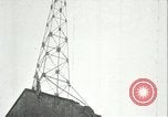 Image of U.S. troops raise flag on radio tower celebrating Armistice France, 1918, second 51 stock footage video 65675065322