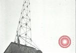 Image of U.S. troops raise flag on radio tower celebrating Armistice France, 1918, second 52 stock footage video 65675065322