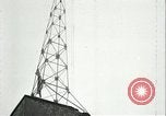 Image of U.S. troops raise flag on radio tower celebrating Armistice France, 1918, second 53 stock footage video 65675065322