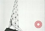 Image of U.S. troops raise flag on radio tower celebrating Armistice France, 1918, second 55 stock footage video 65675065322