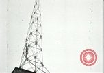 Image of U.S. troops raise flag on radio tower celebrating Armistice France, 1918, second 56 stock footage video 65675065322