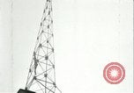 Image of U.S. troops raise flag on radio tower celebrating Armistice France, 1918, second 57 stock footage video 65675065322