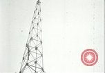 Image of U.S. troops raise flag on radio tower celebrating Armistice France, 1918, second 58 stock footage video 65675065322