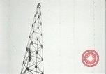 Image of U.S. troops raise flag on radio tower celebrating Armistice France, 1918, second 59 stock footage video 65675065322
