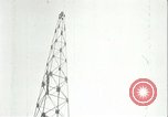 Image of U.S. troops raise flag on radio tower celebrating Armistice France, 1918, second 61 stock footage video 65675065322