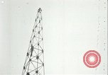 Image of U.S. troops raise flag on radio tower celebrating Armistice France, 1918, second 62 stock footage video 65675065322