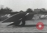 Image of ornithopter man with cardboard wings tries to fly United States USA, 1939, second 3 stock footage video 65675065522