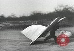 Image of ornithopter man with cardboard wings tries to fly United States USA, 1939, second 5 stock footage video 65675065522