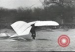 Image of ornithopter man with cardboard wings tries to fly United States USA, 1939, second 9 stock footage video 65675065522