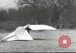 Image of ornithopter man with cardboard wings tries to fly United States USA, 1939, second 10 stock footage video 65675065522