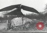 Image of ornithopter man with cardboard wings tries to fly United States USA, 1939, second 13 stock footage video 65675065522