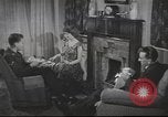Image of U.S. Airman guest in British home United Kingdom, 1953, second 3 stock footage video 65675065566