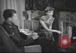 Image of U.S. Airman guest in British home United Kingdom, 1953, second 33 stock footage video 65675065566