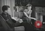 Image of U.S. Airman guest in British home United Kingdom, 1953, second 34 stock footage video 65675065566