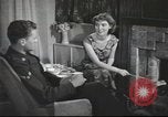 Image of U.S. Airman guest in British home United Kingdom, 1953, second 36 stock footage video 65675065566