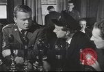 Image of Discussing politics in a Pub United Kingdom, 1953, second 9 stock footage video 65675065568