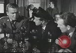 Image of Discussing politics in a Pub United Kingdom, 1953, second 10 stock footage video 65675065568