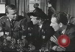 Image of Discussing politics in a Pub United Kingdom, 1953, second 12 stock footage video 65675065568