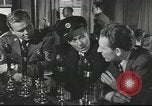 Image of Discussing politics in a Pub United Kingdom, 1953, second 13 stock footage video 65675065568