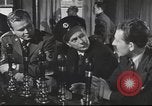 Image of Discussing politics in a Pub United Kingdom, 1953, second 16 stock footage video 65675065568