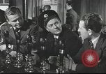 Image of Discussing politics in a Pub United Kingdom, 1953, second 17 stock footage video 65675065568