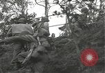 Immagine di Soldati Japanese-American si spostano in posizioni di combattimento Bruyeres Francia, 1944, secondo 45 filmato di repertorio 65675065592