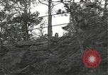 Immagine di Soldati Japanese-American si spostano in posizioni di combattimento Bruyeres Francia, 1944, secondo 56 filmato di repertorio 65675065592
