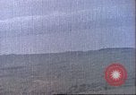 Image of strafing Japanese installations Pacific Theater, 1944, second 9 stock footage video 65675065666