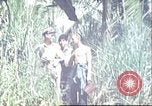 Image of native village Pacific Theater, 1944, second 6 stock footage video 65675065674
