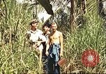 Image of native village Pacific Theater, 1944, second 7 stock footage video 65675065674