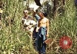 Image of native village Pacific Theater, 1944, second 9 stock footage video 65675065674