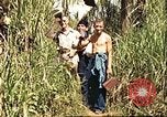Image of native village Pacific Theater, 1944, second 12 stock footage video 65675065674