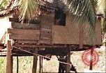 Image of native village Pacific Theater, 1944, second 15 stock footage video 65675065674