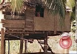 Image of native village Pacific Theater, 1944, second 20 stock footage video 65675065674