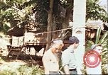 Image of native village Pacific Theater, 1944, second 25 stock footage video 65675065674
