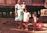 Image of native village Pacific Theater, 1944, second 37 stock footage video 65675065674