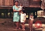 Image of native village Pacific Theater, 1944, second 41 stock footage video 65675065674